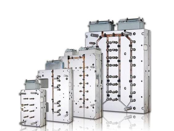 What are the advantages of using hot runner systems in injection molding
