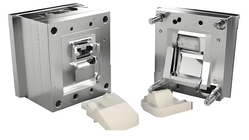 Detailed view of the injection mold and the produced plastic parts