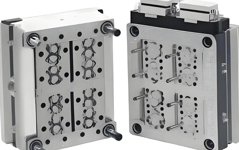 Two parts of an injection mold are shown