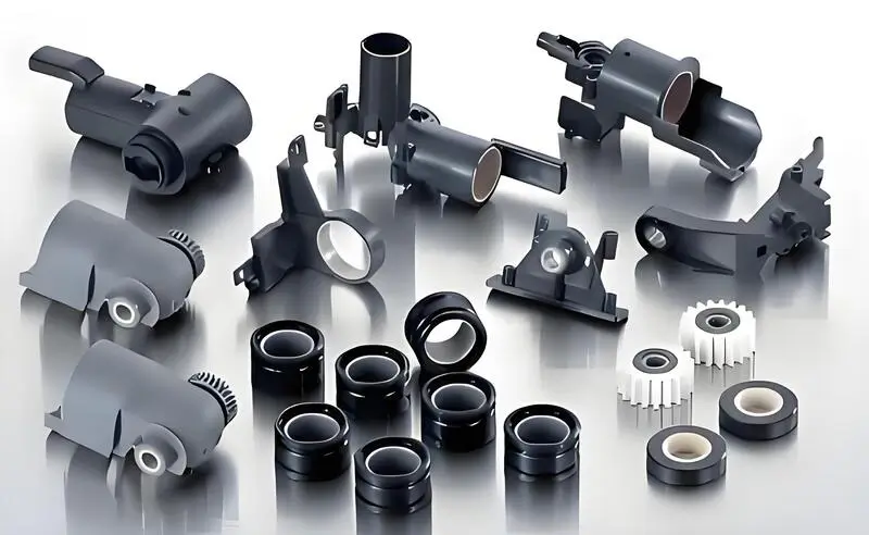 White and black injection molded gears of various sizes and shapes