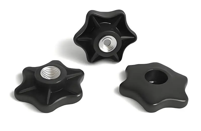 Three black injection molded star knobs with threaded centers
