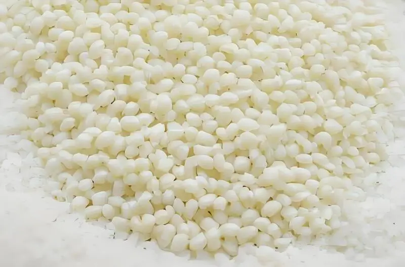 injection molding raw materials on a solid color background