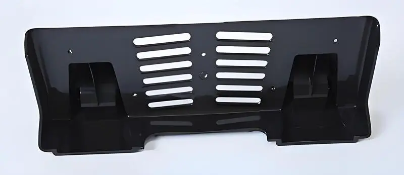 Automotive injection molded parts displayed on a white background