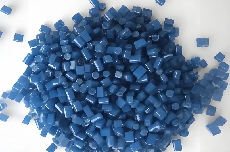 A pile of blue injection molding material polypropylene (PP) pellets on a white background