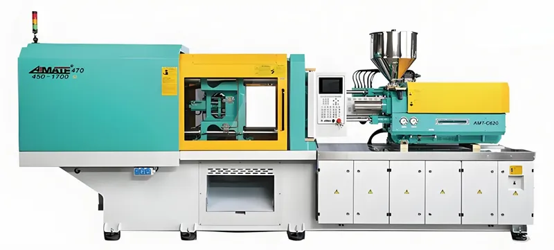 A large industrial injection molding machine with a green and yellow exterior