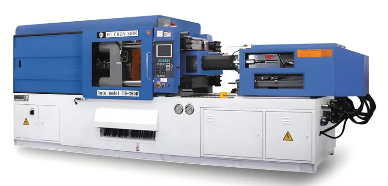 Large blue and white injection molding machine with a control panel and various components