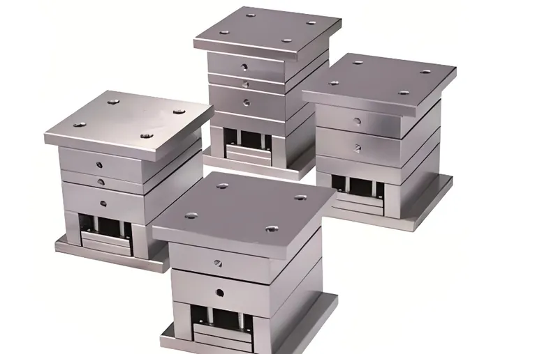 Four metallic mold bases with rectangular structures and multiple layers
