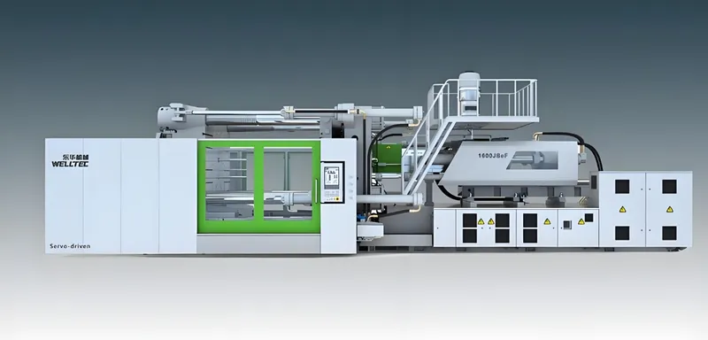 Side view of a Welltec servo-driven injection molding machine with a control panel and safety labels